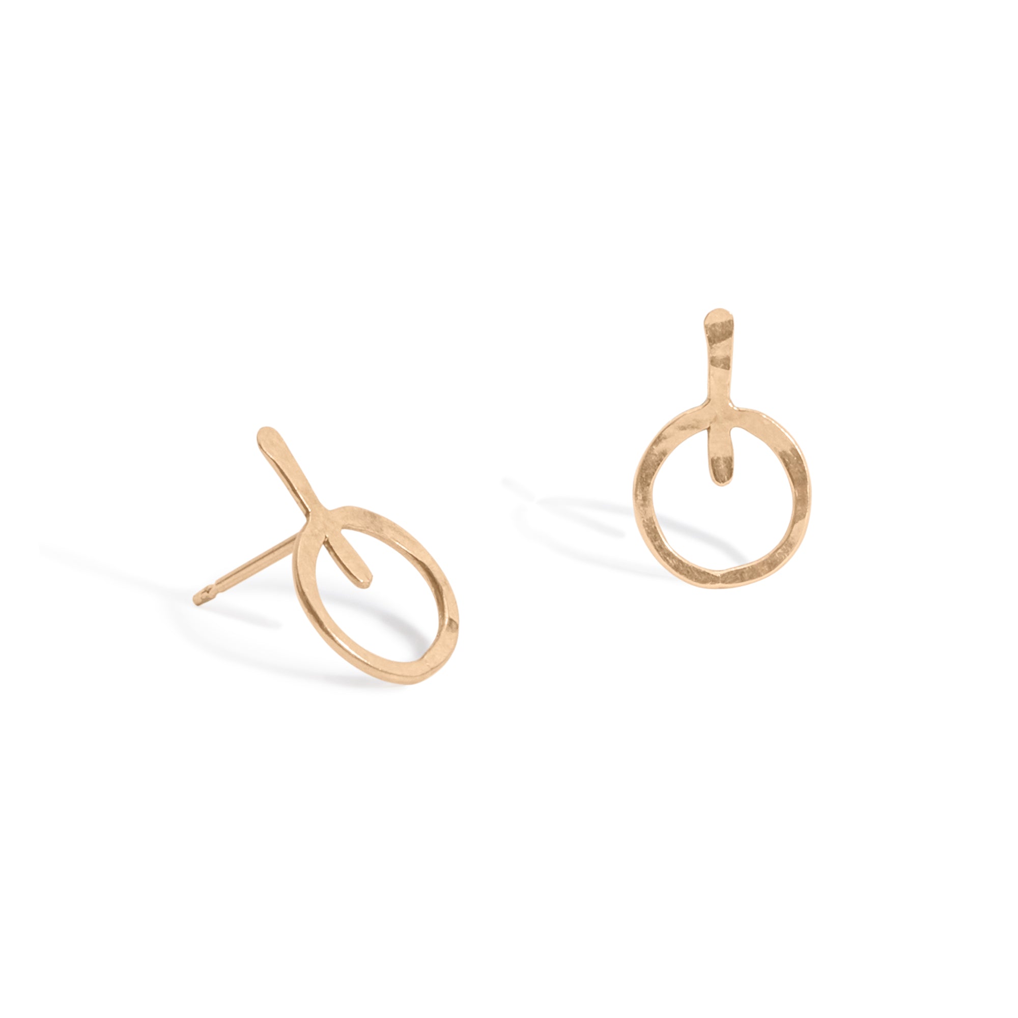 The Evolve Studs, 14k gold earrings featuring a hammered circle attached to a small vertical wire bar.