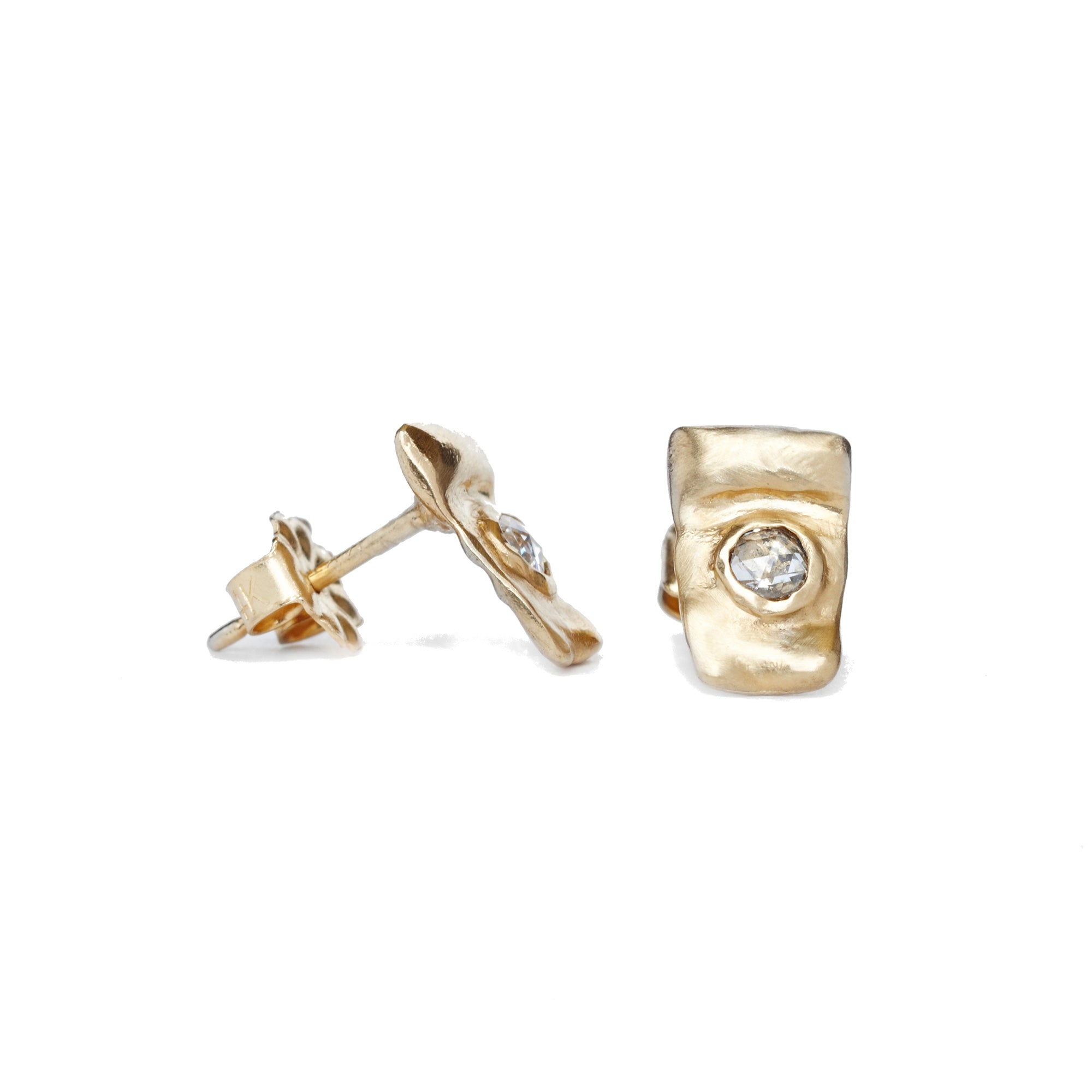Our Pebble Studs are everyday organic studs in solid 14k yellow gold with bezel set rose cut diamonds.