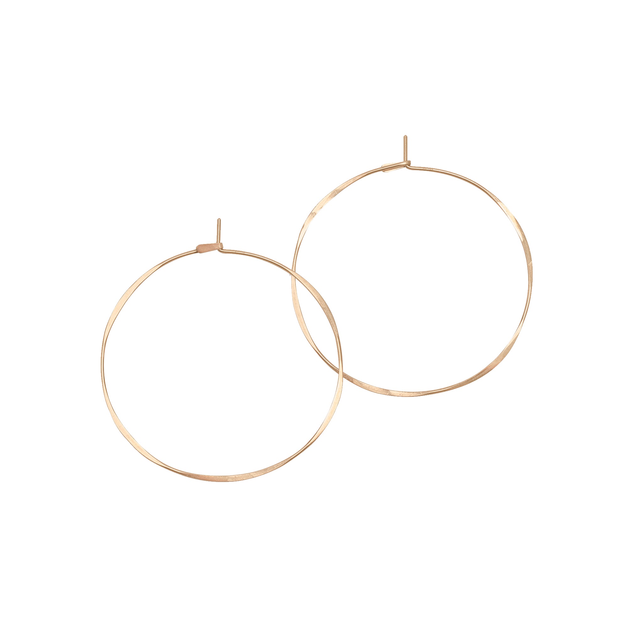 Classic Round Hoops in 14k gold, featuring an organic, hammered texture and quality craftsmanship.