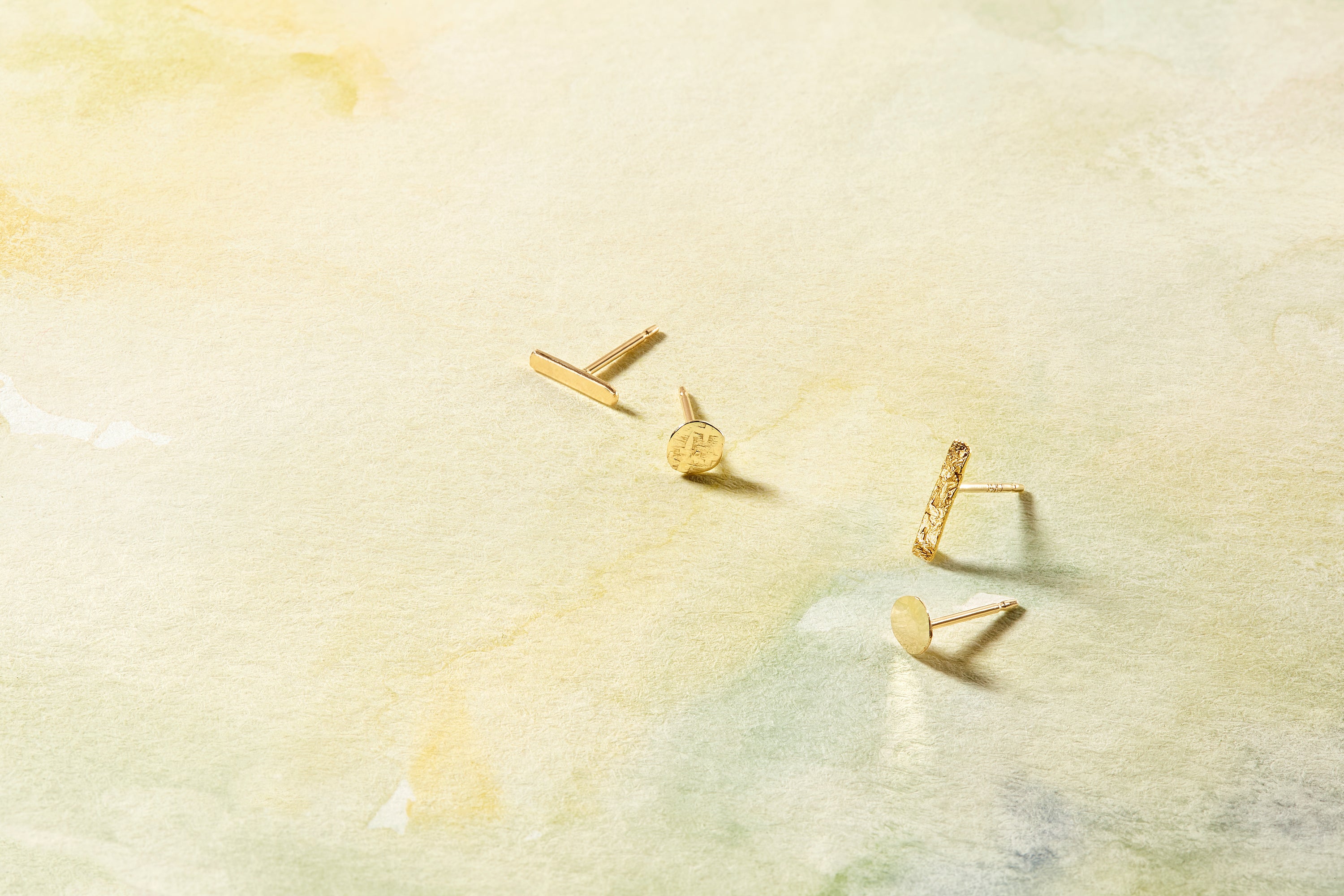 The Dot Stud, modern simplicity in 14k gold with your choice of classic hammered textured or nugget texture