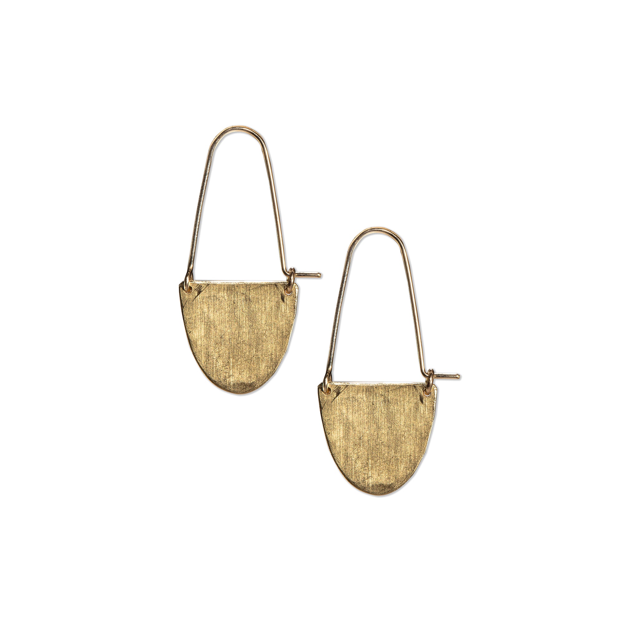The Half Moon Hoop Earrings feature a hammered brass semi-circle that suspends delicately from 14K gold-fill wires