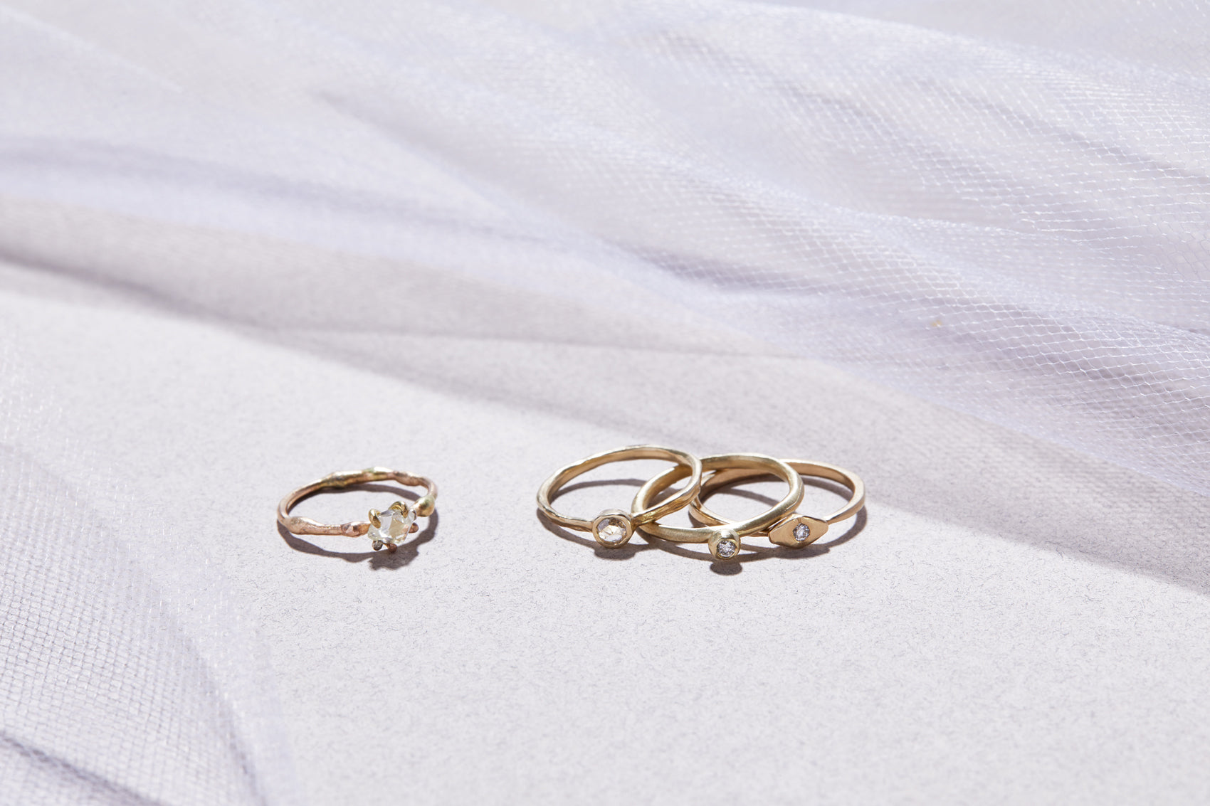 The delicate Slope Ring is an elegant band with a flush set 0.04 tcw diamond on an organic hammered 14k gold band.The delicate Slope Ring is an elegant band with a flush set 0.04 tcw diamond on an organic hammered 14k gold band.