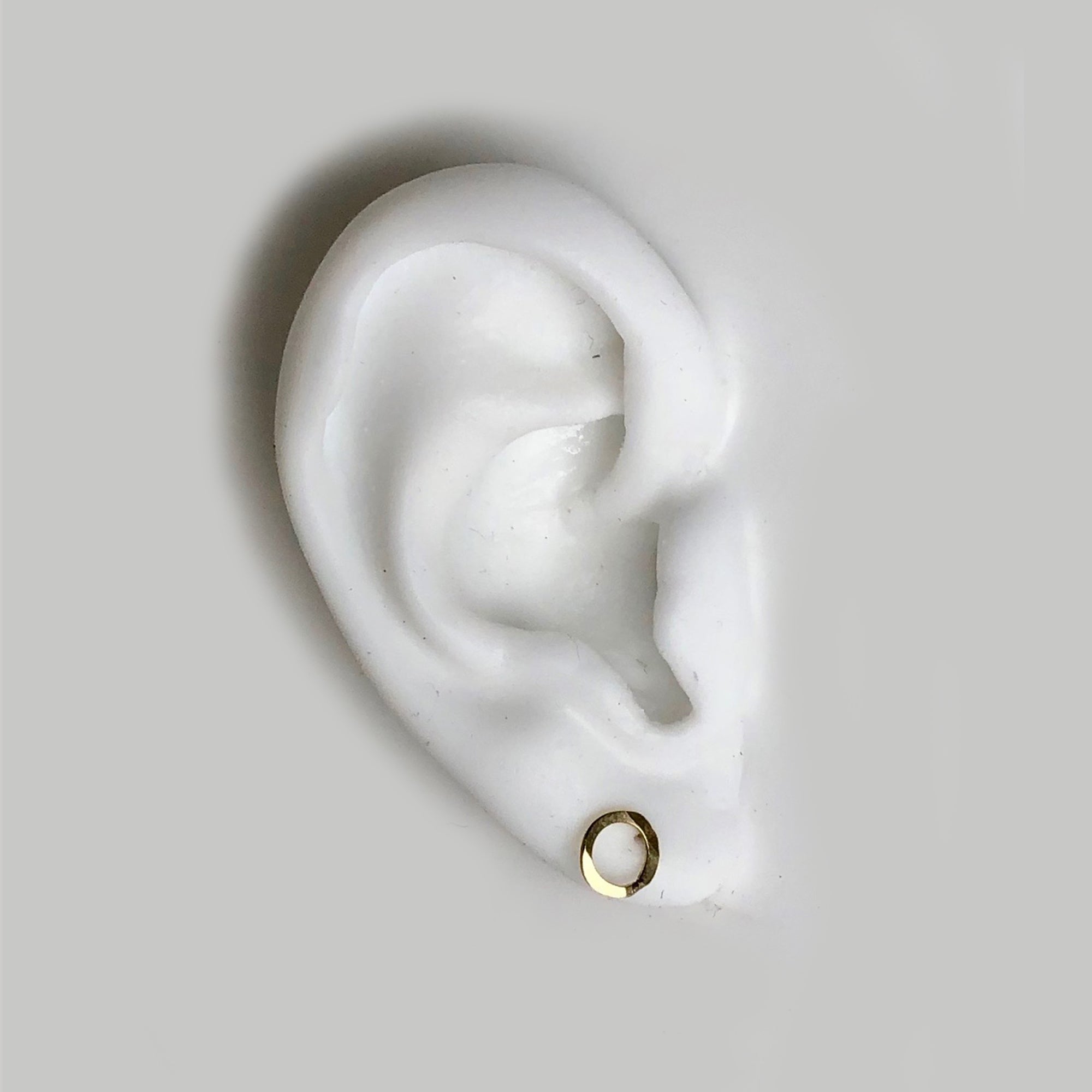 One-of-a-kind, 14k gold set features organic hand forged studs inspired by our collaboration with artist Callen Thompson 