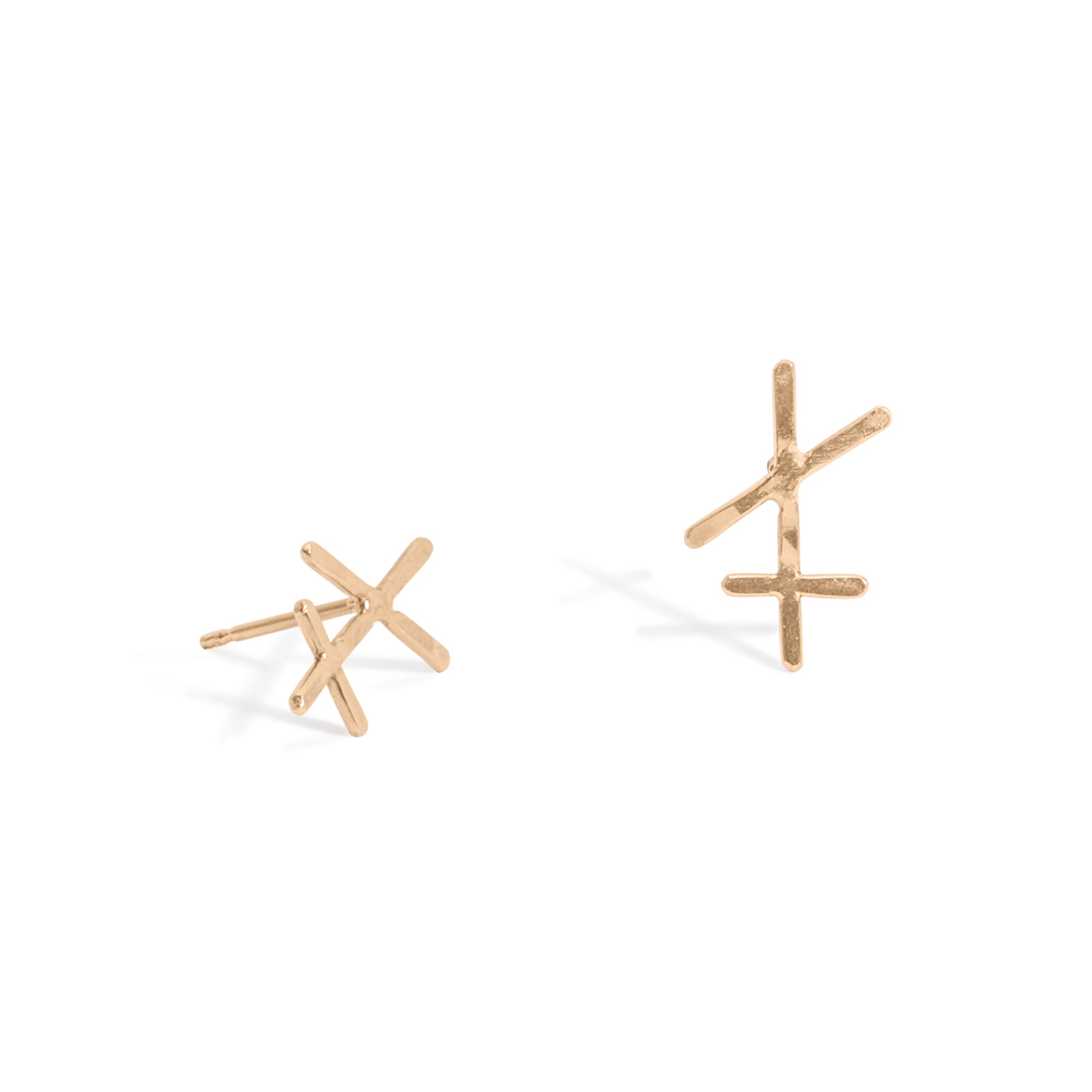 Chaos Studs, featuring a petite hammered wire bar with two intersecting lines. These modern studs are handmade from 14k gold