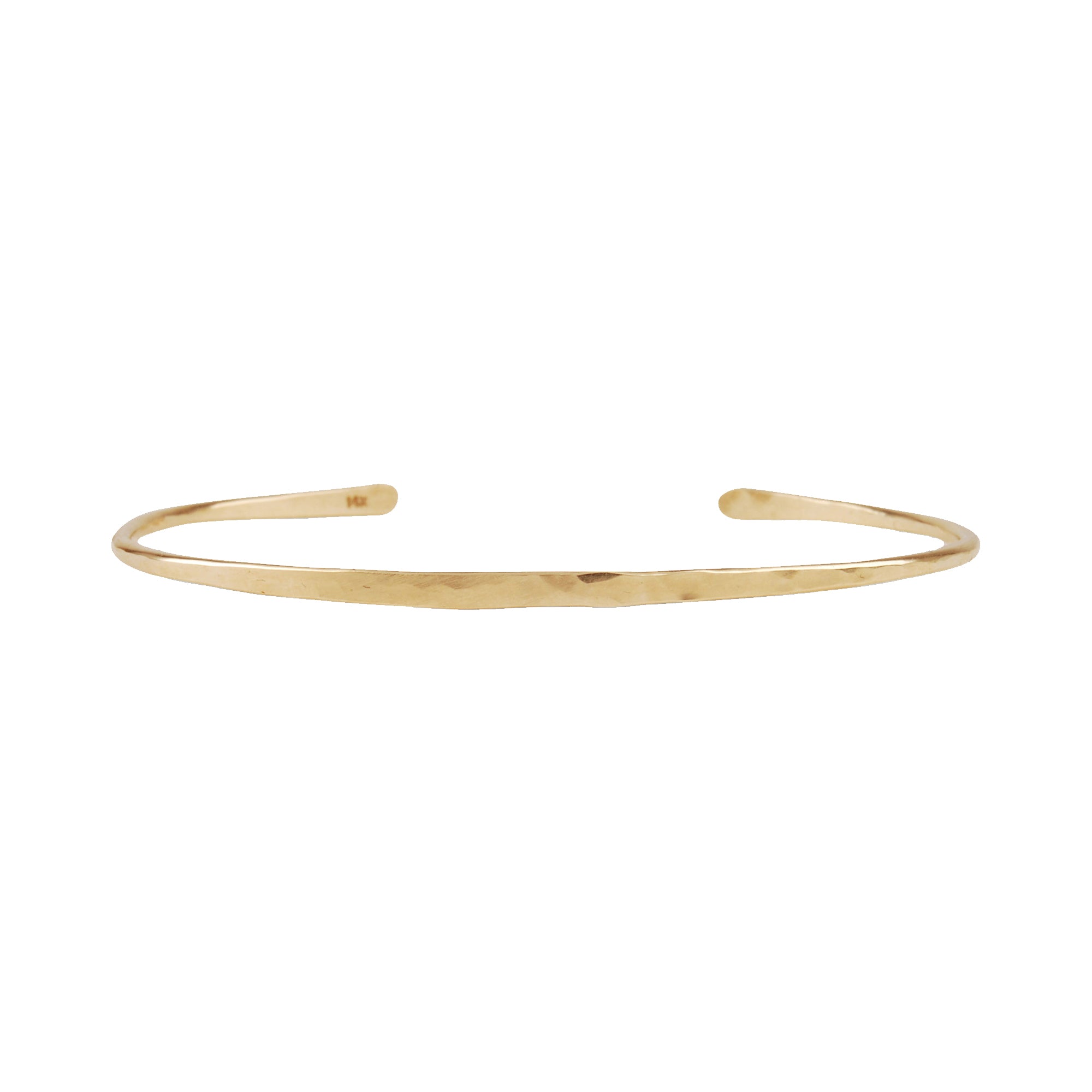 14k gold Thin Cuff, hand-forged and hammered, this modern cuff fits snugly around the curve of your wrist. 