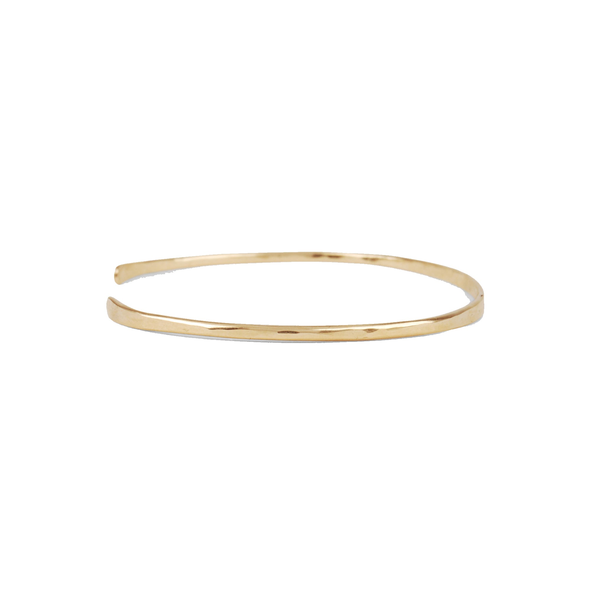 14k gold Thin Cuff, hand-forged and hammered, this modern cuff fits snugly around the curve of your wrist. 