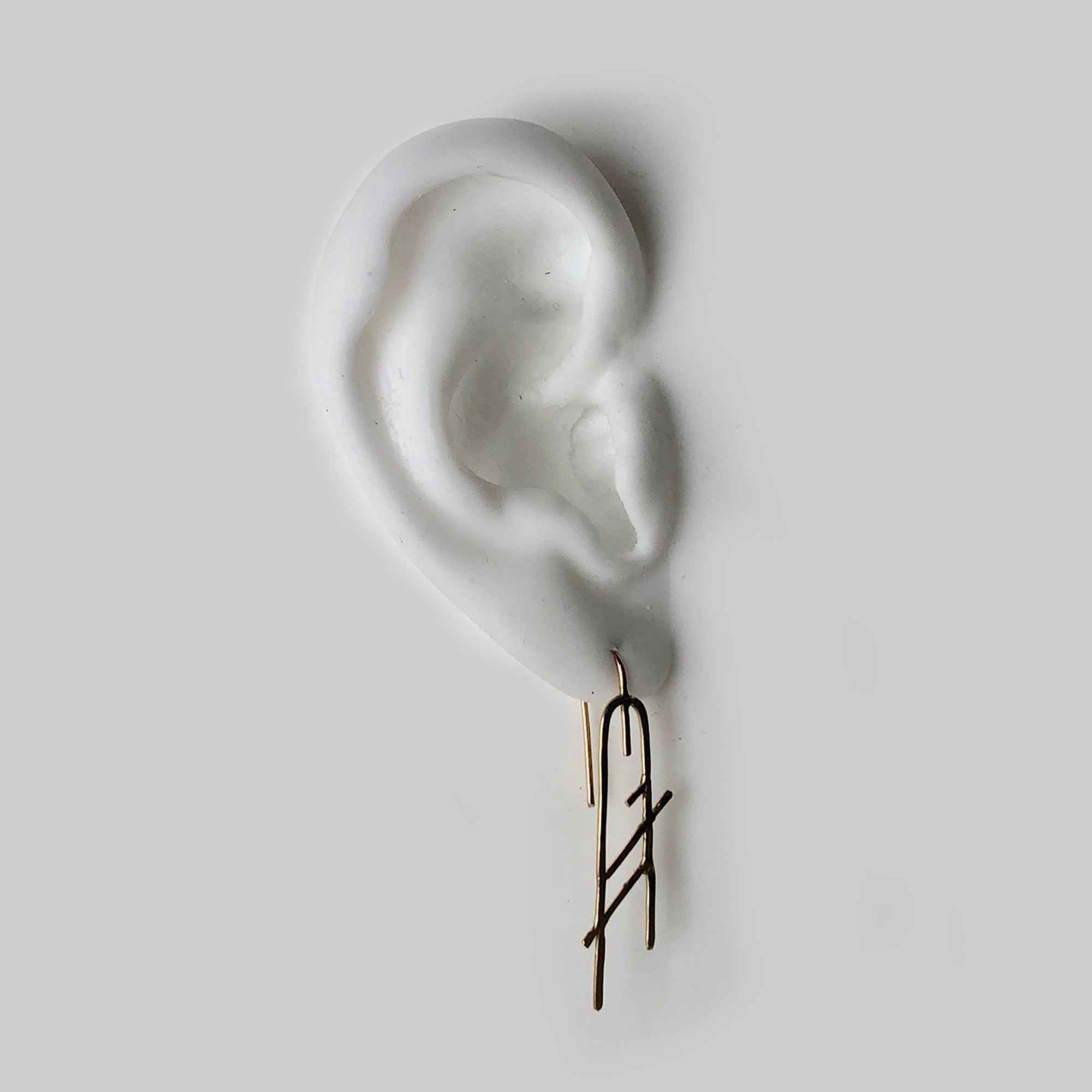 Moab Hook Earrings in 14k gold, these delicate one-of-a-kind earrings are from our collaboration with Callen Thompson 