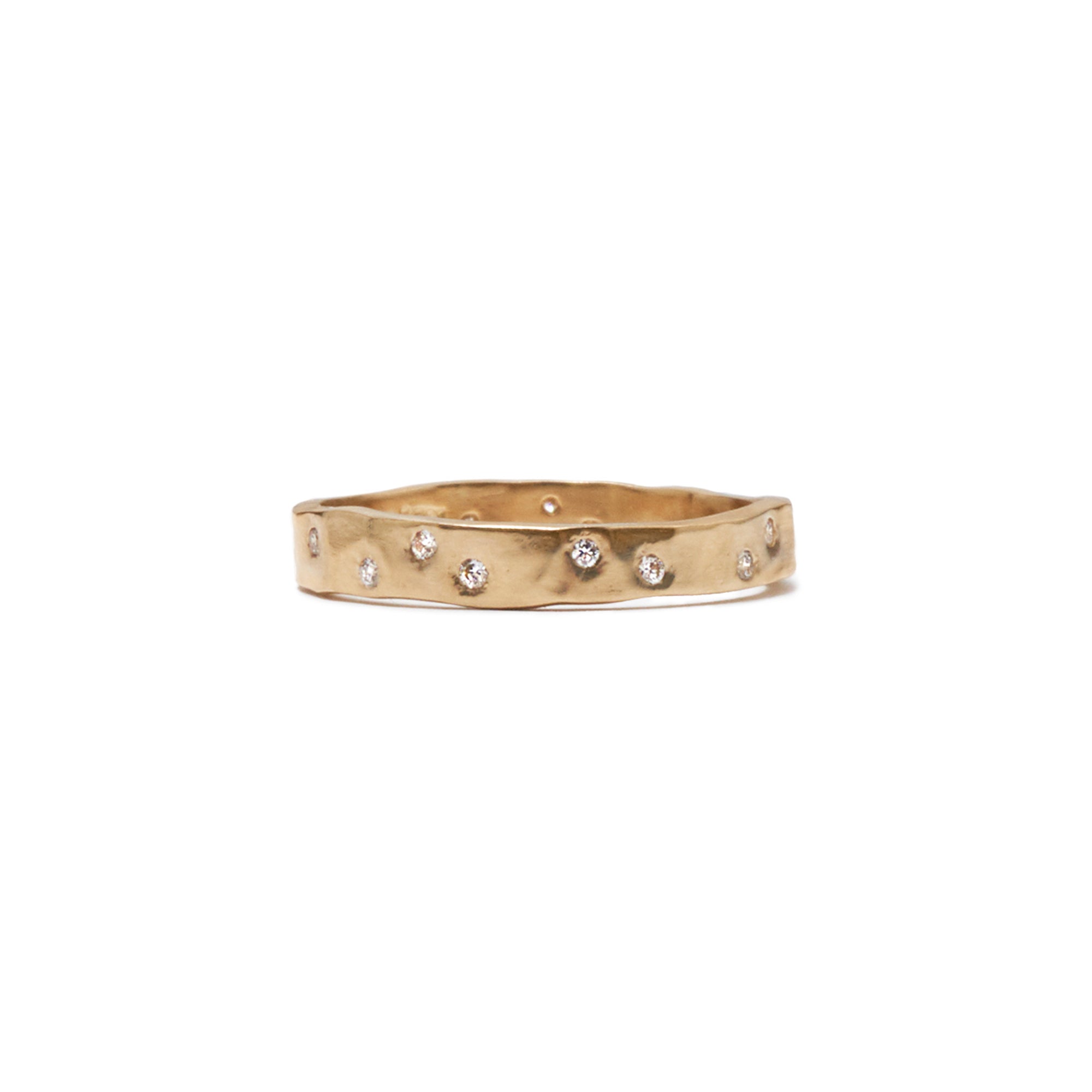 A modern take on a classic band, the Constellation Band showcases 17 white diamonds scattered around a hammered band.