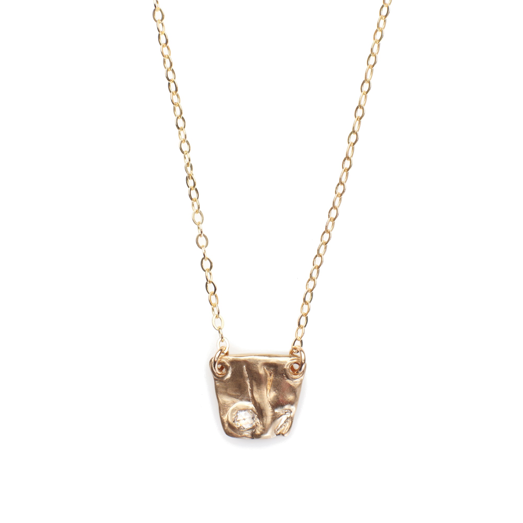 Our Pebble Necklace is a sweet pendant necklace with a rose cut diamond bezel set in solid 14k gold. 