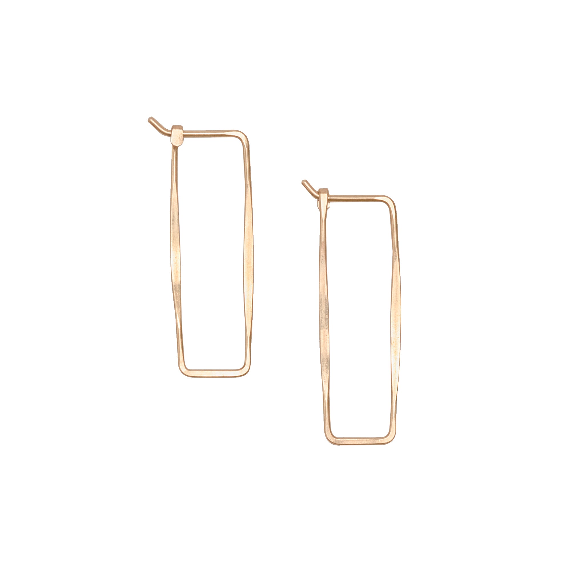 The Thin Rectangle Hoop in hand hammered 14k gold is a contemporary alternative to the traditional hoop.