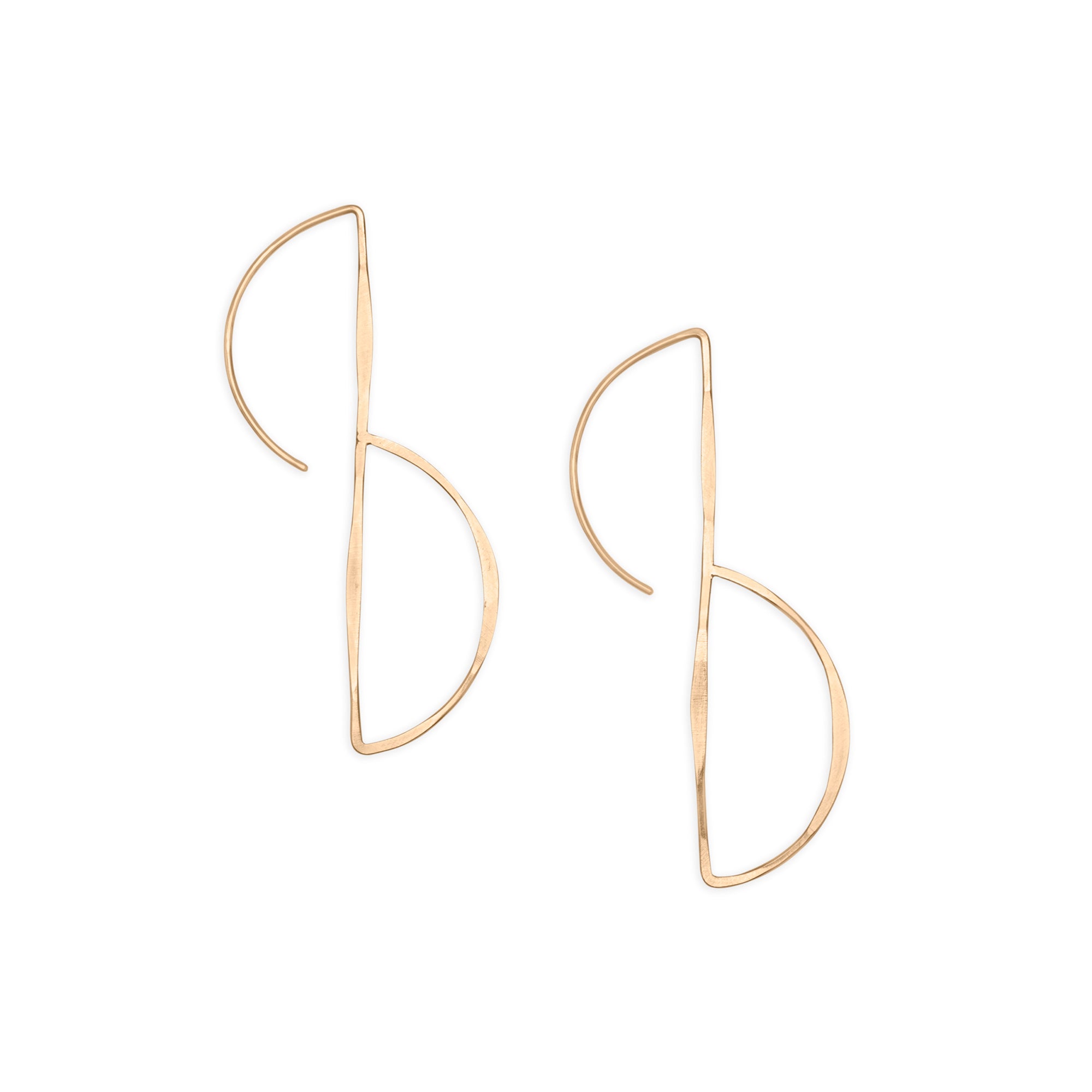The Union Hook earring features a forward-facing semicircle suspended delicately from a 14k wire drop