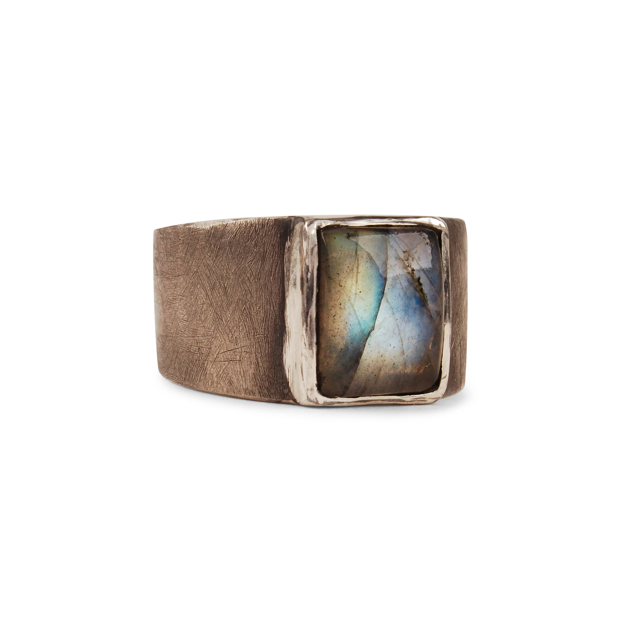 The Grit Rectangle Ring features a rectangular bezel set cabochon stone in your choice of labradorite or lapis