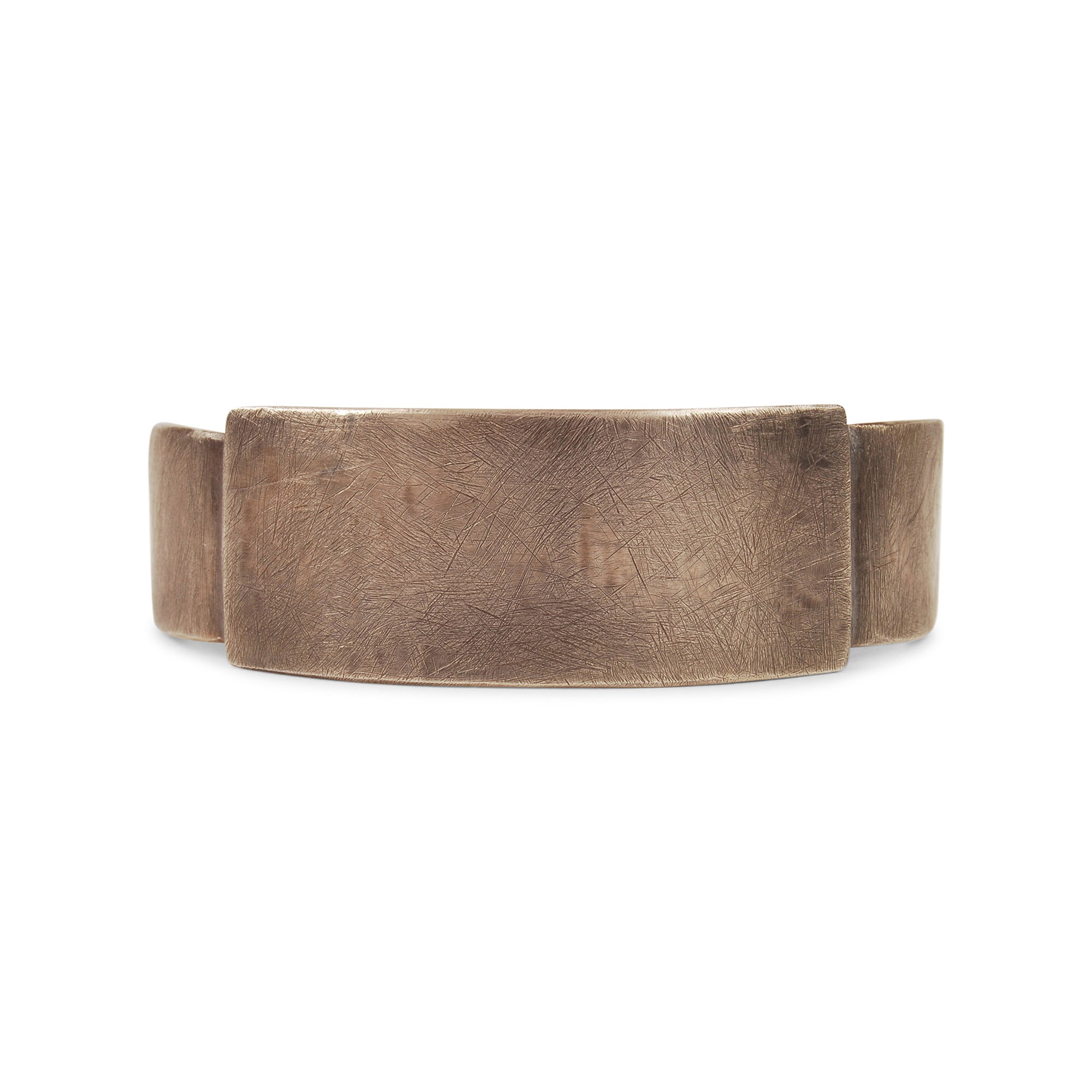 The Grit Wide Stepped Cuff is crafted in sterling silver, featuring a rough-hewn texture and oxidation