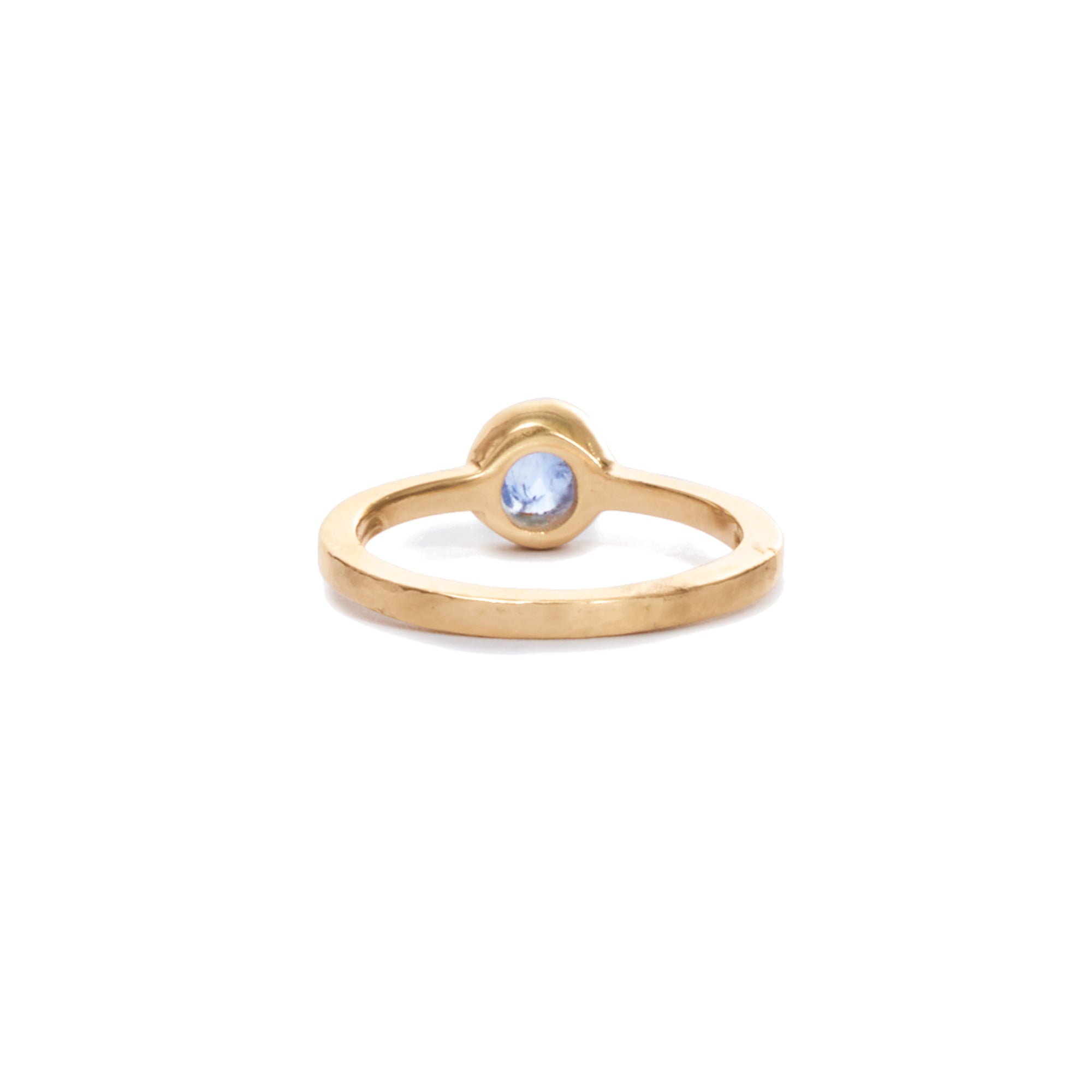 Our blue sapphire solitaire is a modern take on the classic favorite, featuring a round blue sapphire bezel set in 14k gold