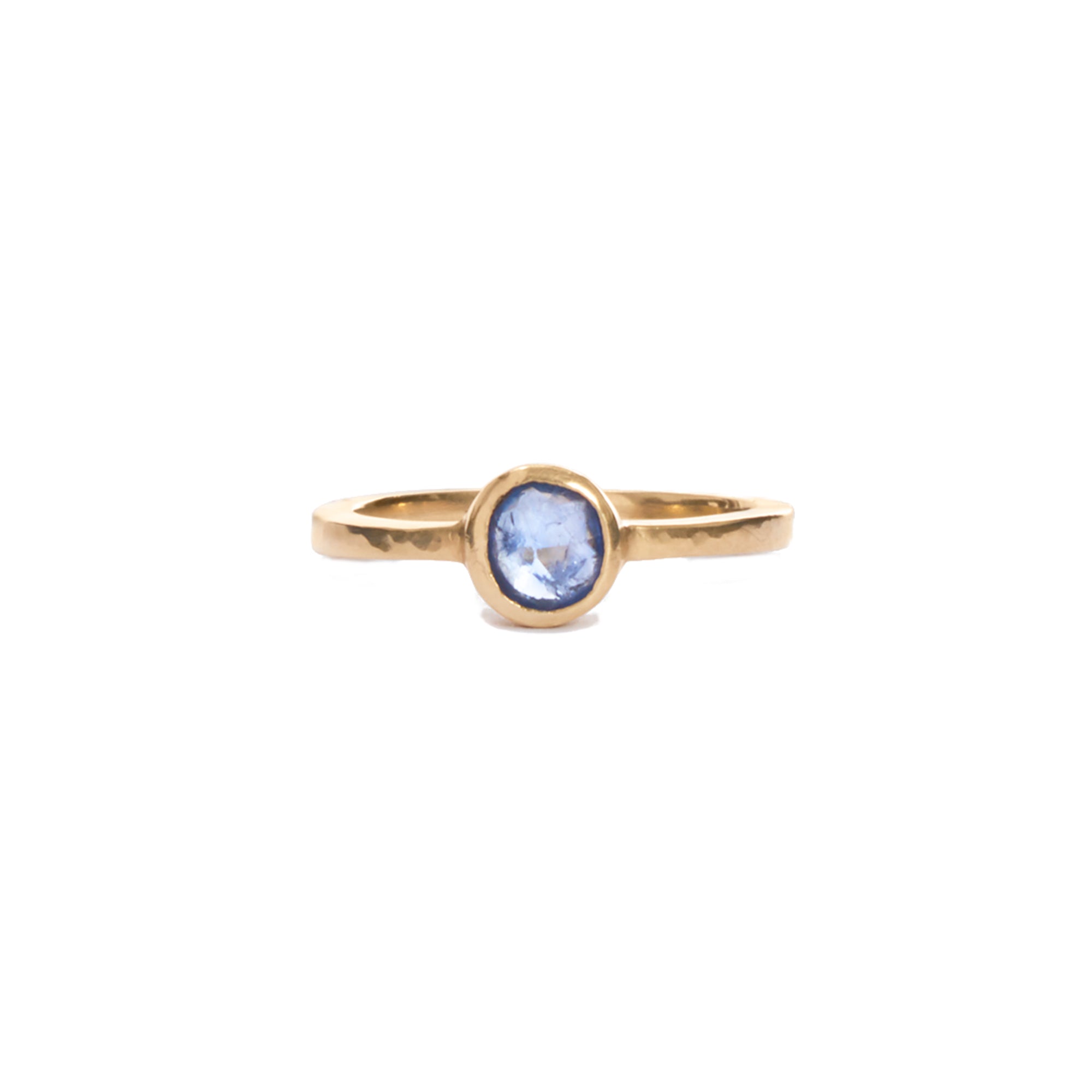 Our blue sapphire solitaire is a modern take on the classic favorite, featuring a round blue sapphire bezel set in 14k gold