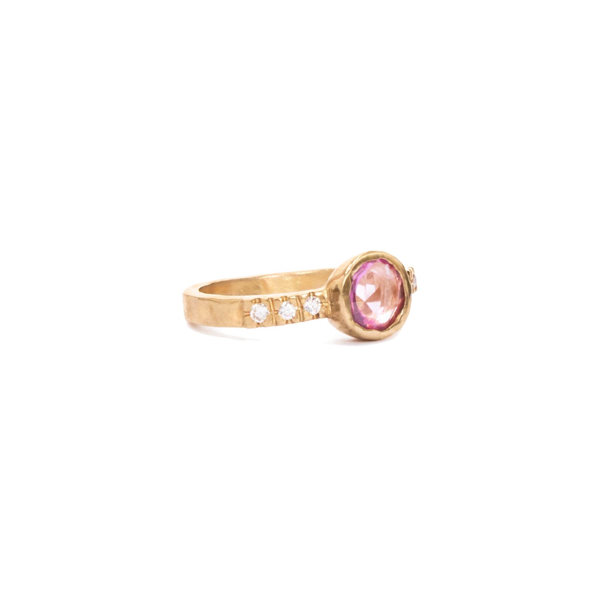 Our pink sapphire and white diamond solitaire is the perfect engagement ring for the alternative bride. 