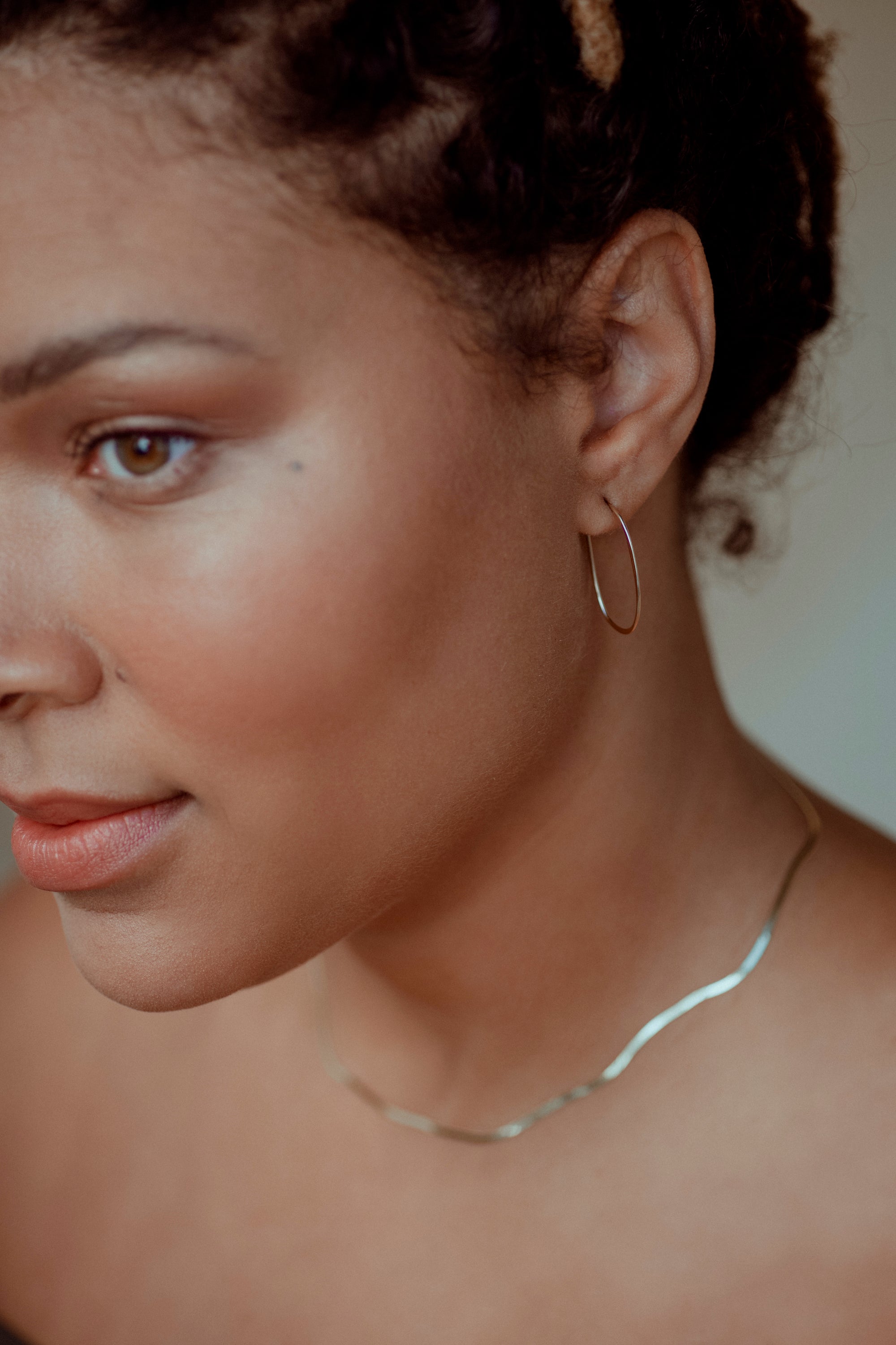14k gold Wide Second Skin Necklace delicately follows the contours of your body and catches the light as you move. 