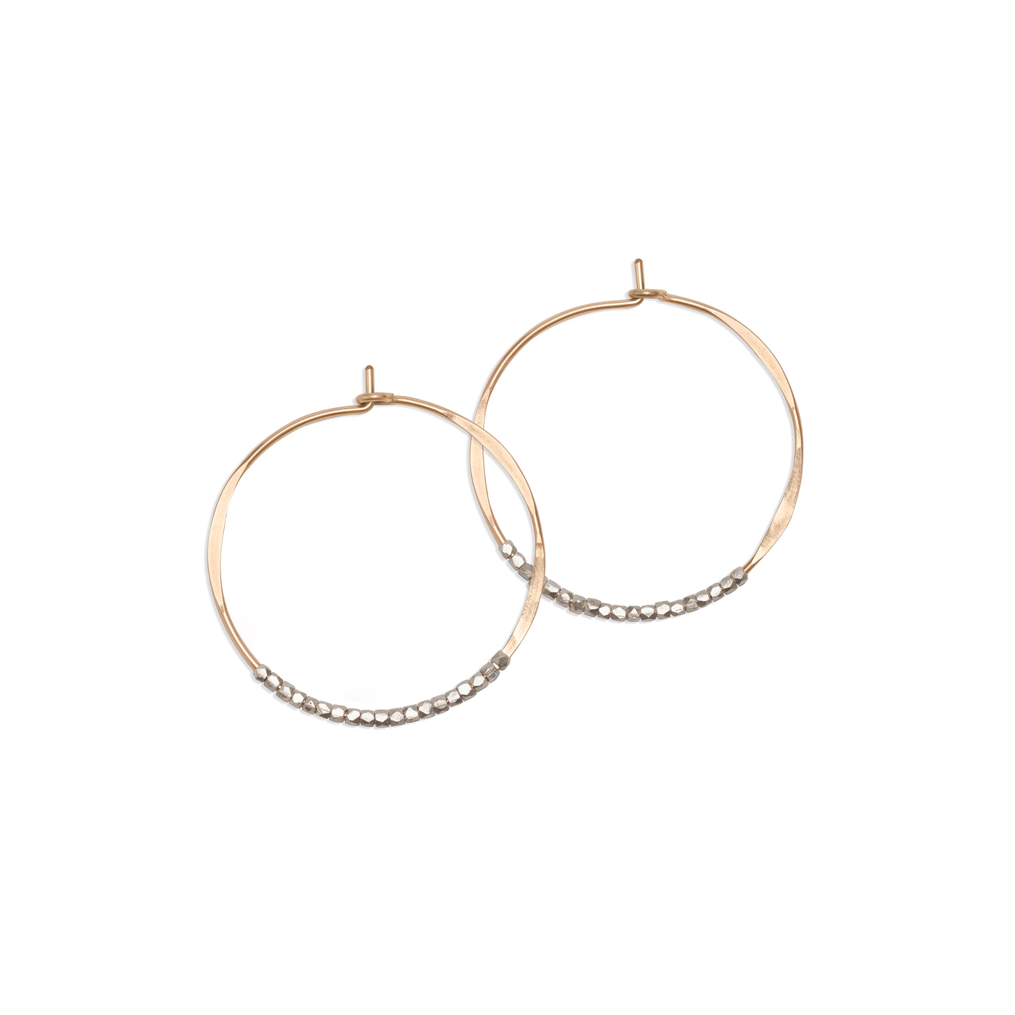These Bead Hoop Earrings are embellished with delicate sterling silver beads, making them effortless and eye catching