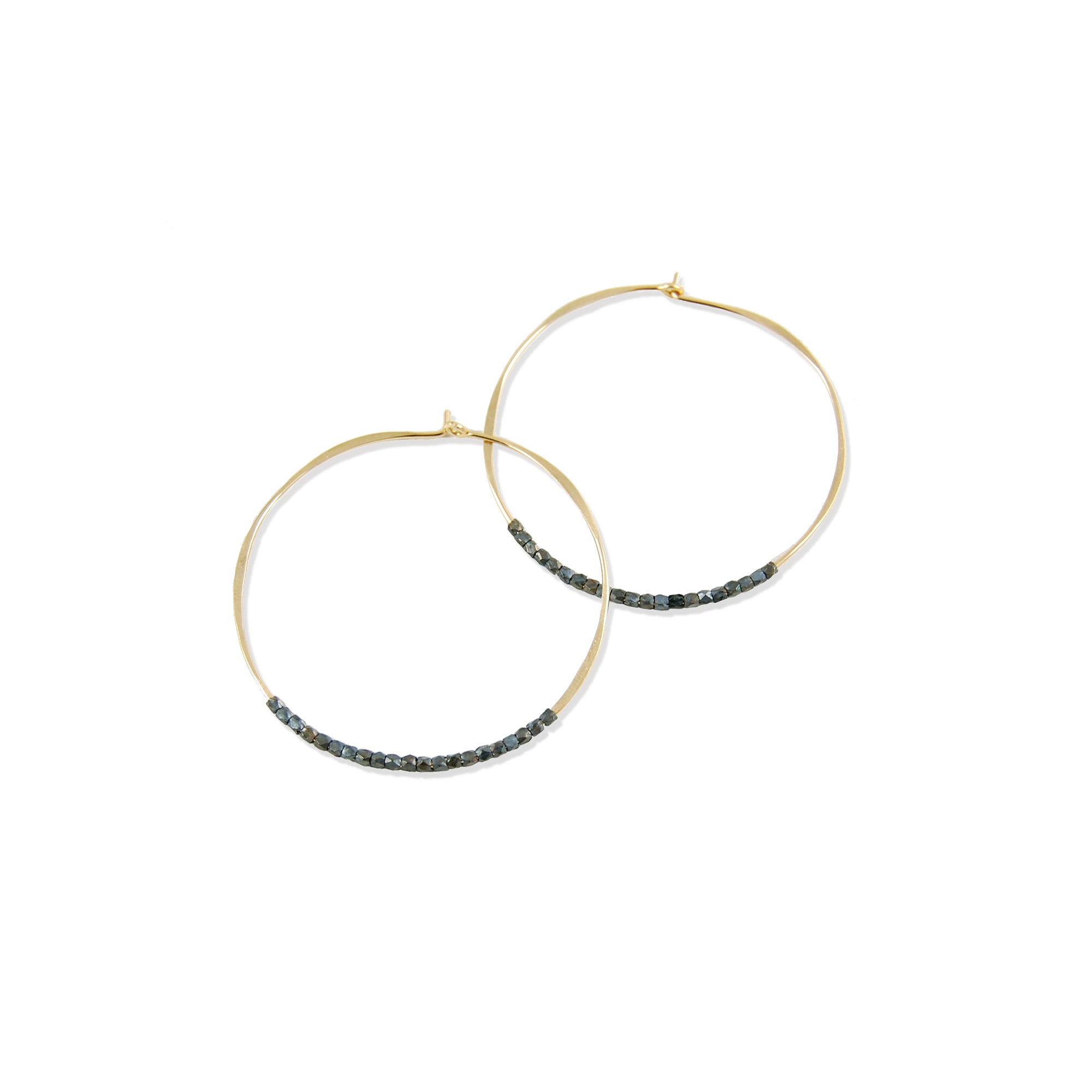 The Oxidized Bead Hoops are classic, lightweight earrings adorned with delicate oxidized sterling silver beads.