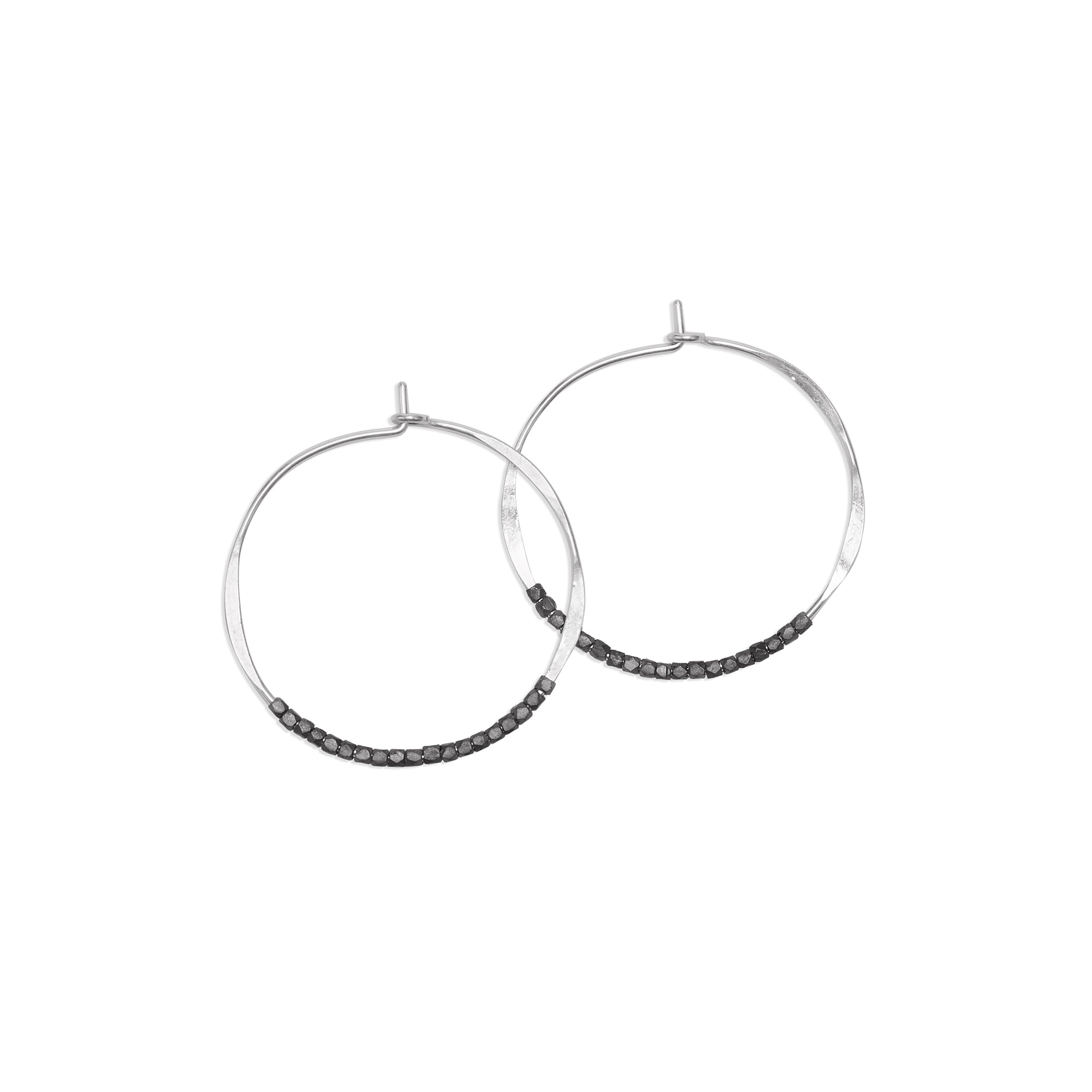 The Oxidized Bead Hoops are classic, lightweight earrings adorned with delicate oxidized sterling silver beads.