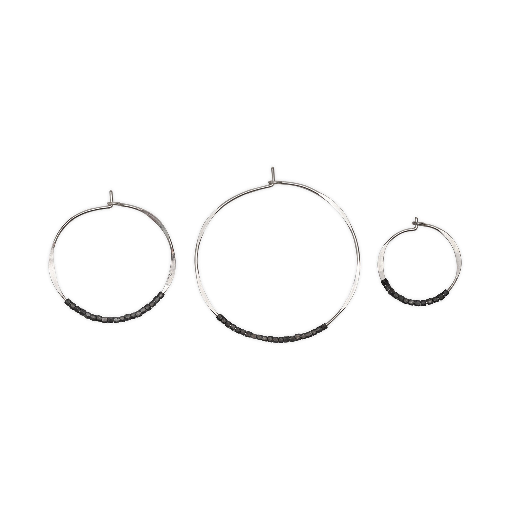 These Bead Hoop Earrings are embellished with delicate sterling silver beads, making them effortless and eye catching
