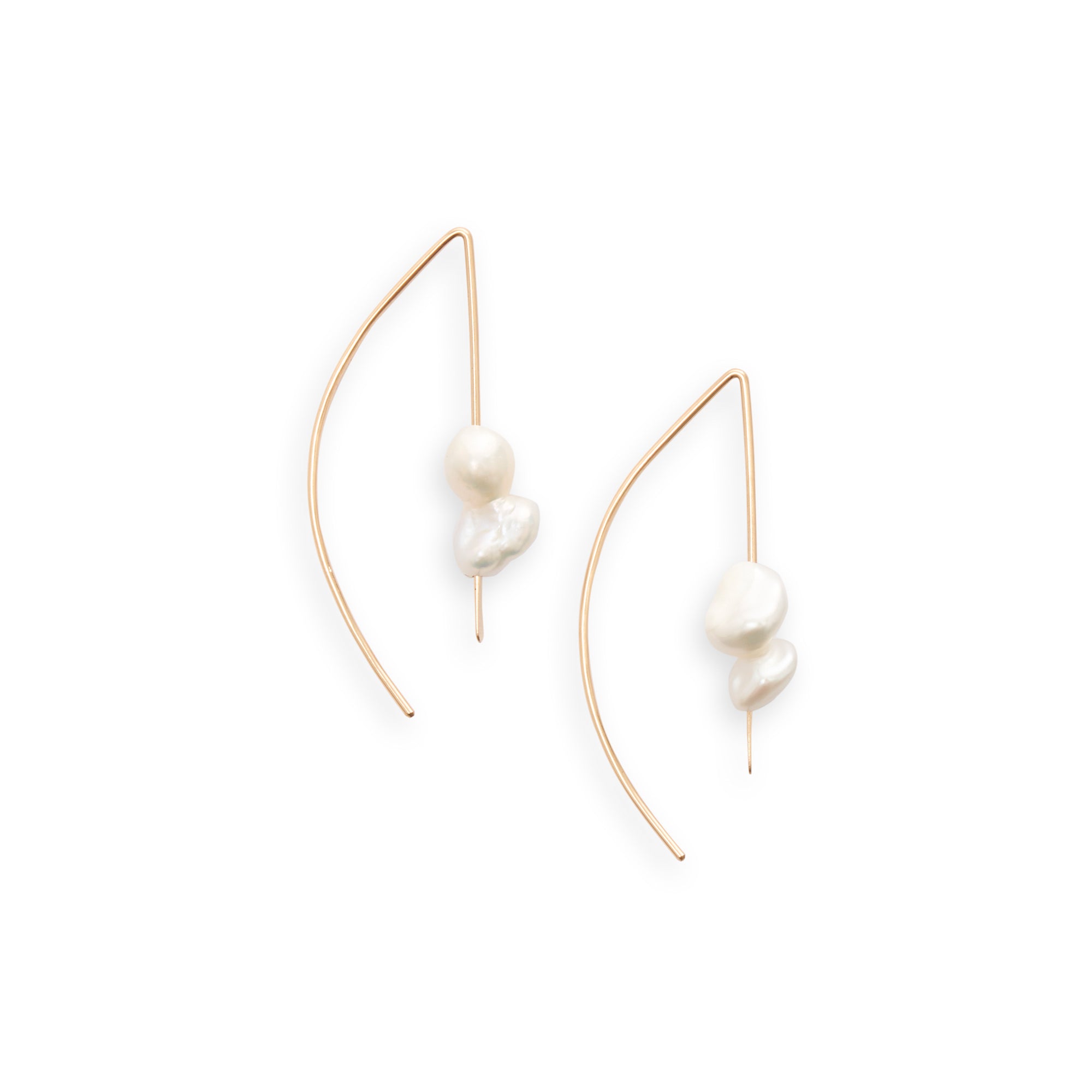 A modern threader earring with drops of Keshi pearls to add an element of classic elegance.   