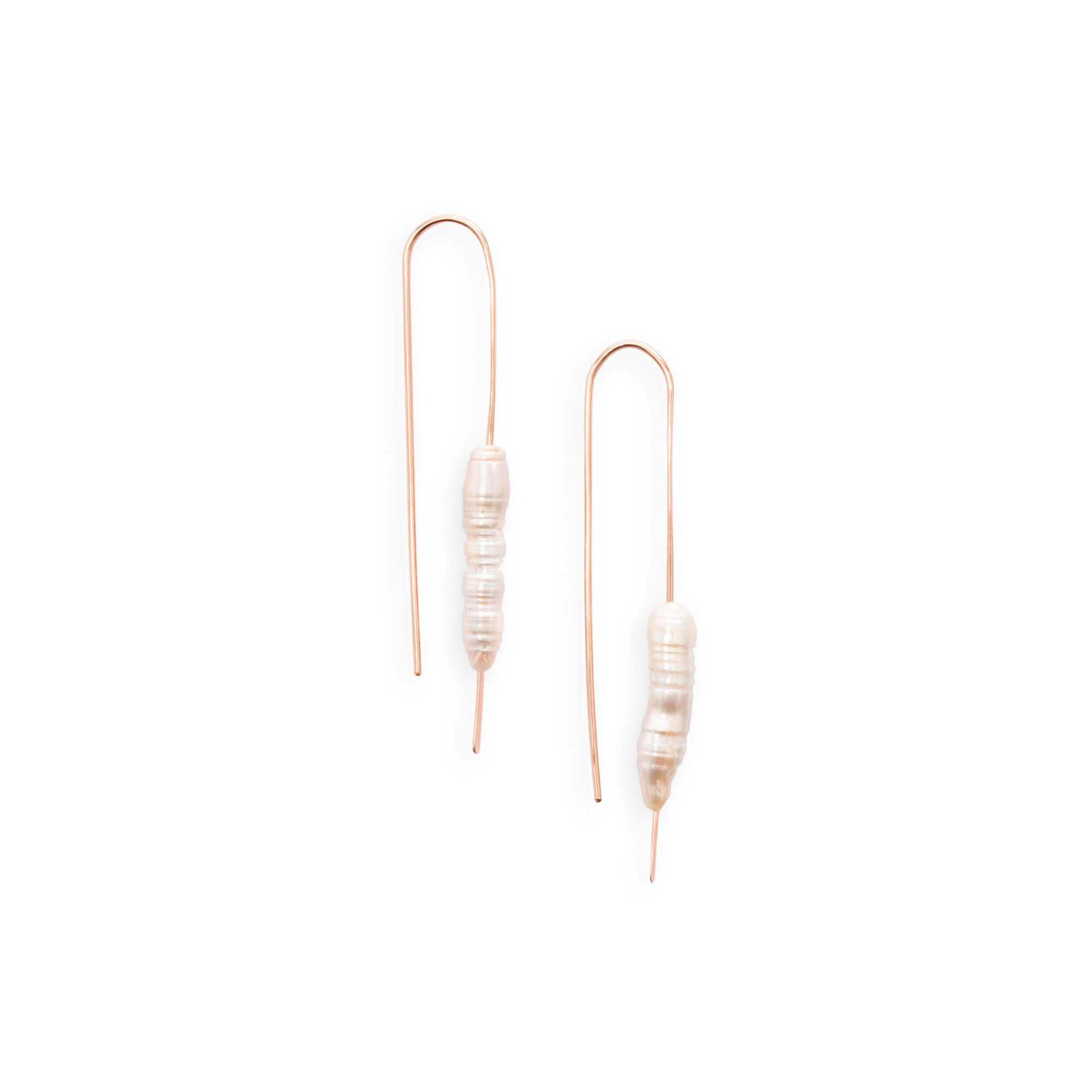 The Long Pearl Earrings feature a column of freshwater pearls that lend an organic element to an understated look