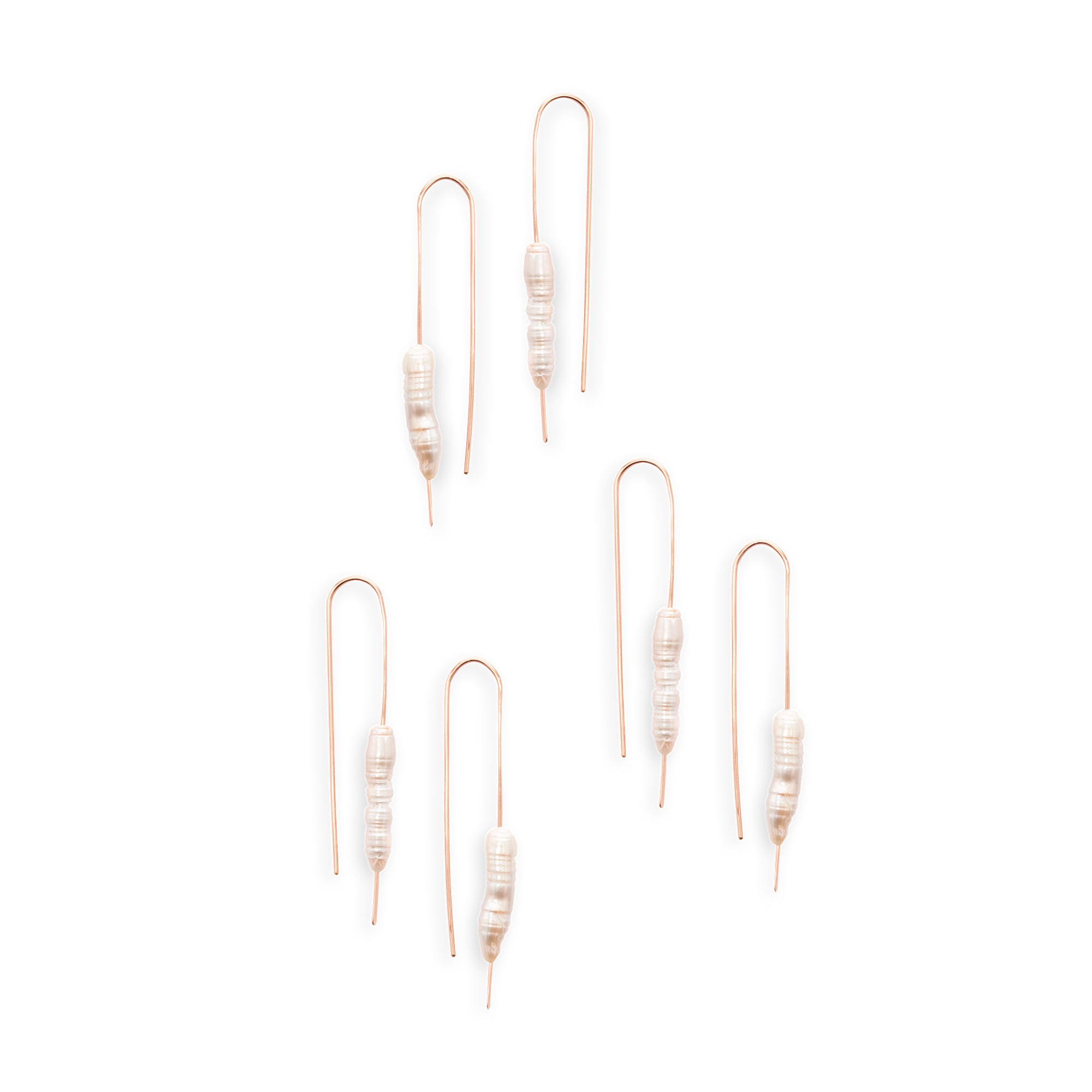 The Long Pearl Earrings feature a column of freshwater pearls that lend an organic element to an understated look